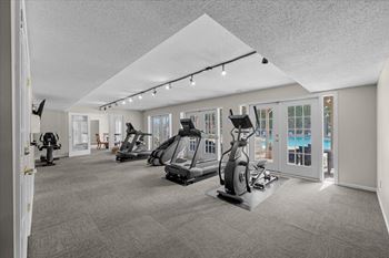 A spacious gym with a variety of exercise equipment.